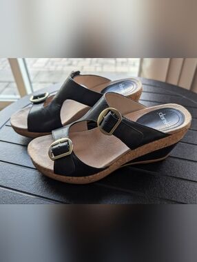 Dansko Carla Black Leather Wedge Sandals with Brass Buckles